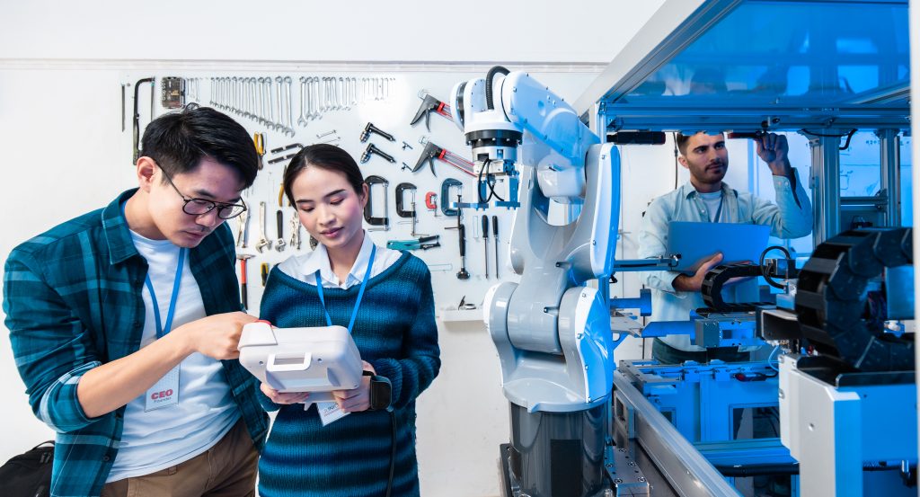 Engineering and manufacturing professionals working with industrial automation equipment